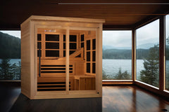 Golden Designs Monaco Limited Edition 6-person Near Zero EMF FAR Infrared Sauna in windowed room with view of lake behind